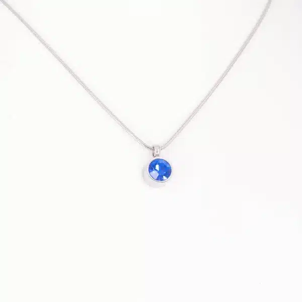 Magnetanhänger Stille Kraft mit einem blauen Zirkonia