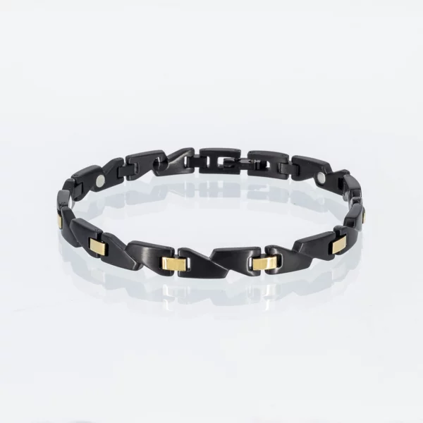 Eigenwilliges Energiearmband in schwarz und gold
