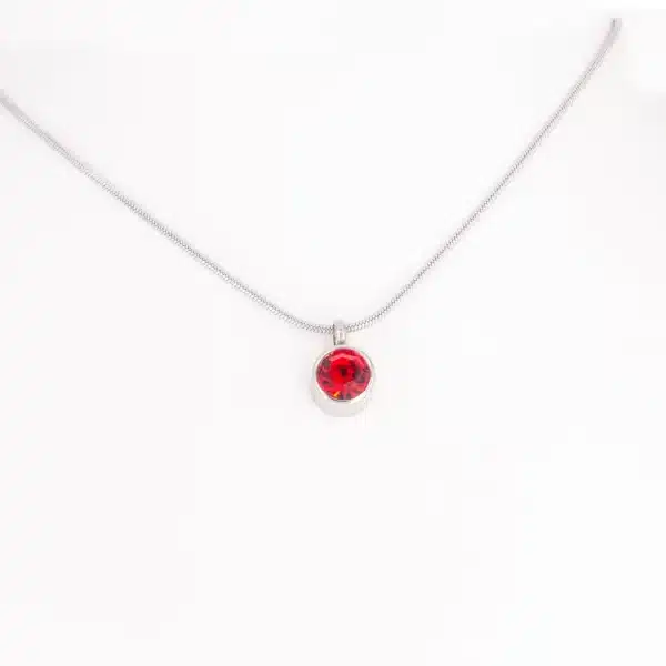 Magnetanhänger Stille Kraft mit einem roten Zirkonia